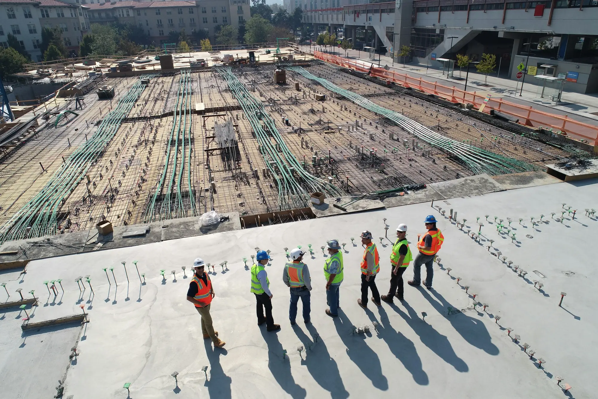 A construction crew standing on a building site
